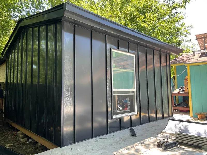 Black standing seam metal wall panels for Roof Inspection in Riviera Beach