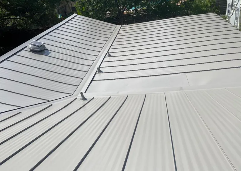 Solar attic fan installed on a metal roof for Roof Ventilation in Riviera Beach